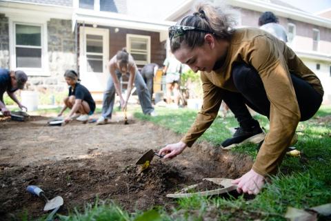 Person digging in the dirt
